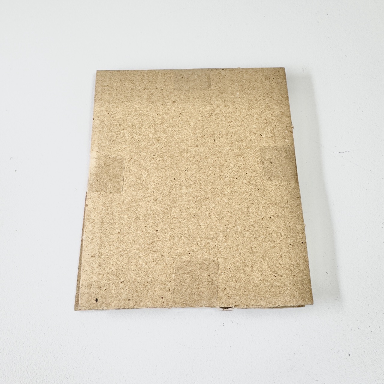 We tape every edge so the layered pack stays sealed.